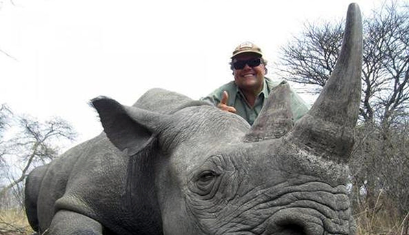 Big game hunter Jimmy John Liautaud is the owner of Jimmy John's Gourmet Sandwiches. His chain serves an excellent vegan sandwich. Here Liataud bags one of about 5,000 black rhinos remaining in the world. 