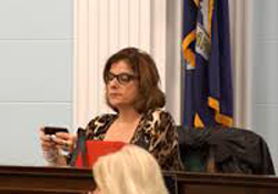 Kristen Grandinetti is seen texting during a council meeting.