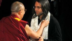 The Dalai Lama places the white scarf of purity on Keith Raniere